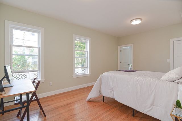 a bedroom with a bed and a table