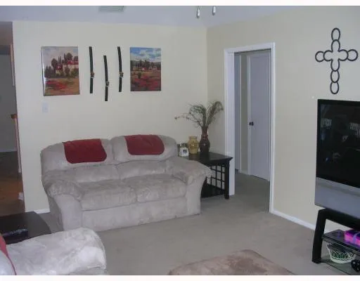 a bedroom with a bed and a chair