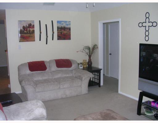 3012 Todd Circle Ingleside, TX 78362 - Photo 3 of 10 a bedroom with a bed and a chair