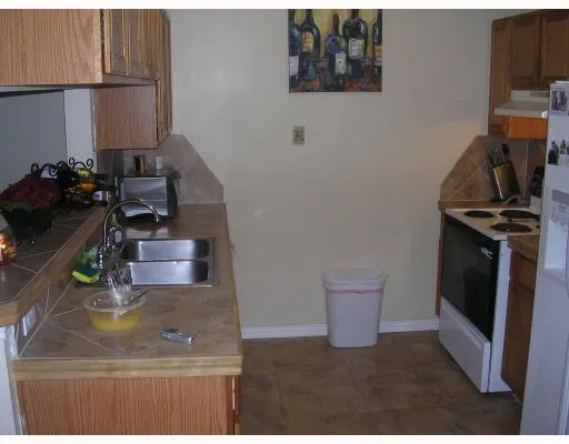 a kitchen with a sink and a stove