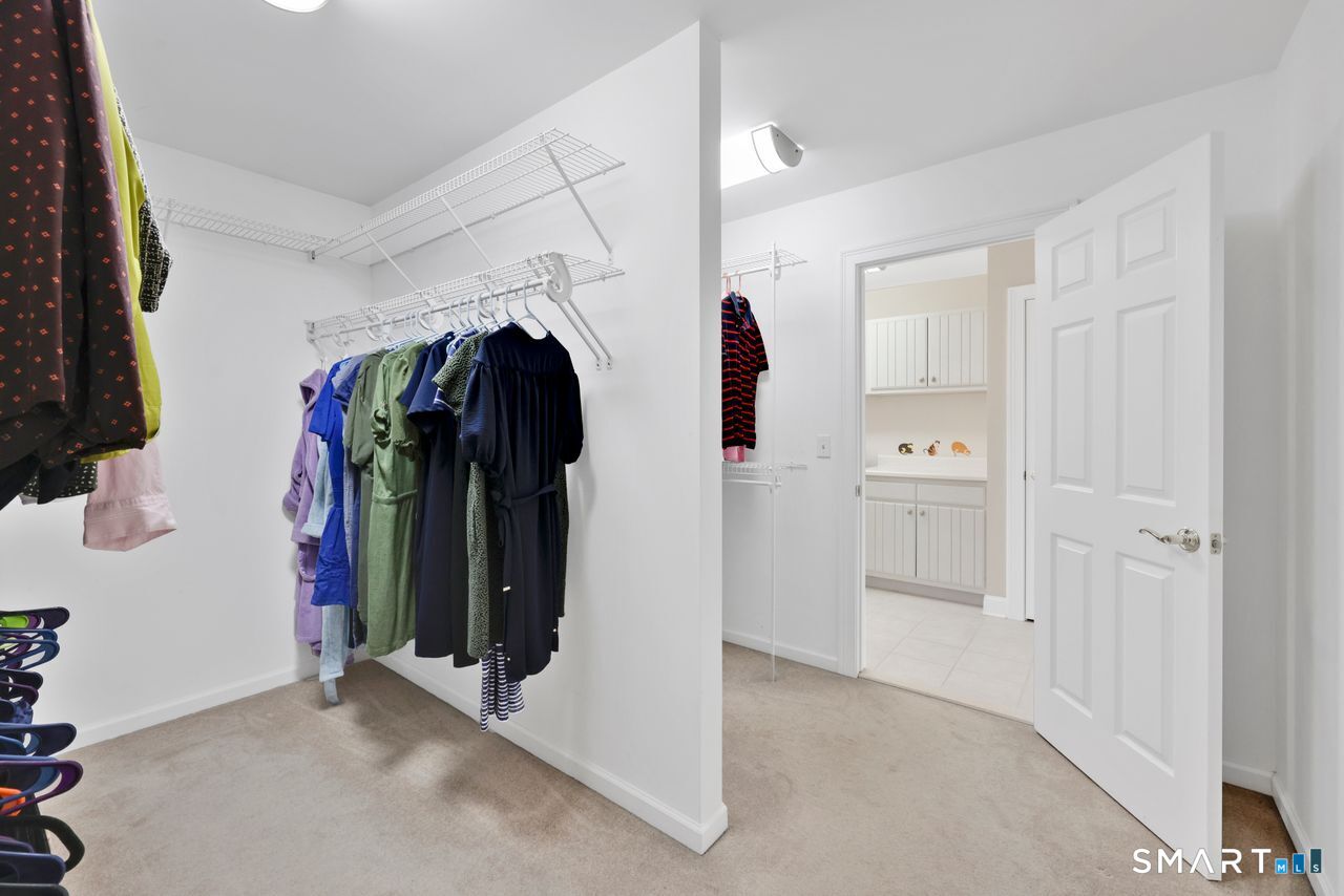 1 Bramble Trail Newtown, CT 06470 - Photo 16 of 31 a view of walk in closet with clothes
