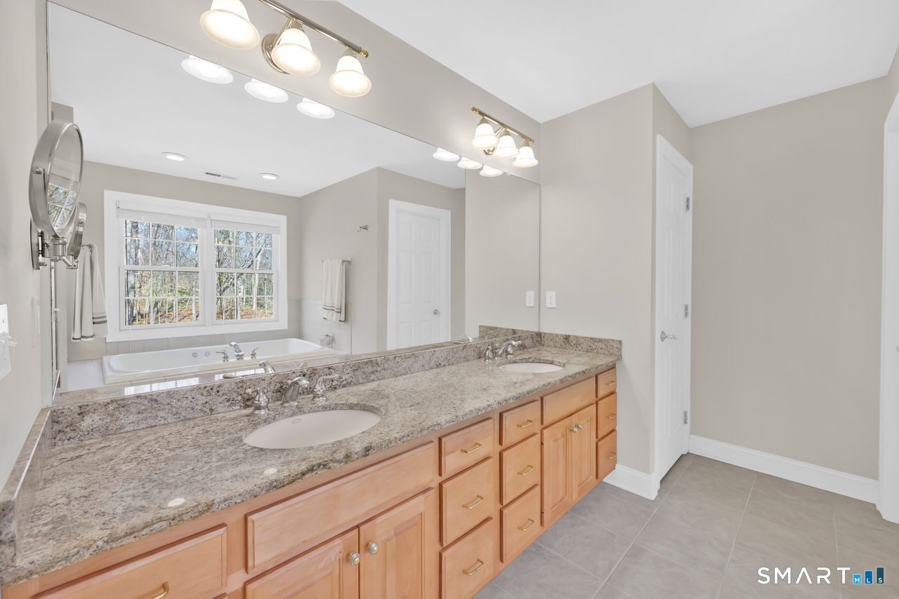 1 Bramble Trail Newtown, CT 06470 - Photo 17 of 31 a bathroom with a granite countertop sink mirror and double