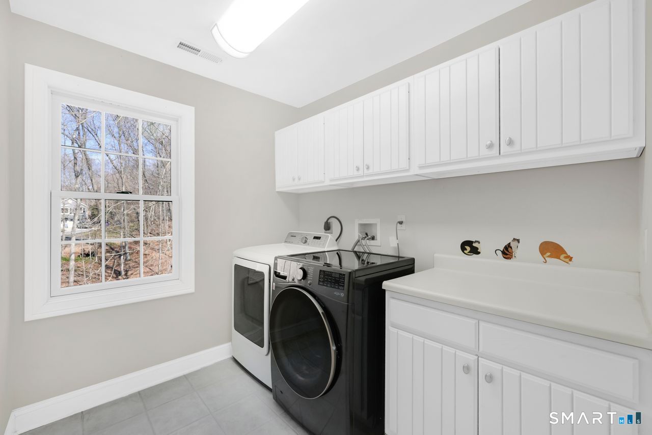 1 Bramble Trail Newtown, CT 06470 - Photo 25 of 31 a utility room with dryer and washer