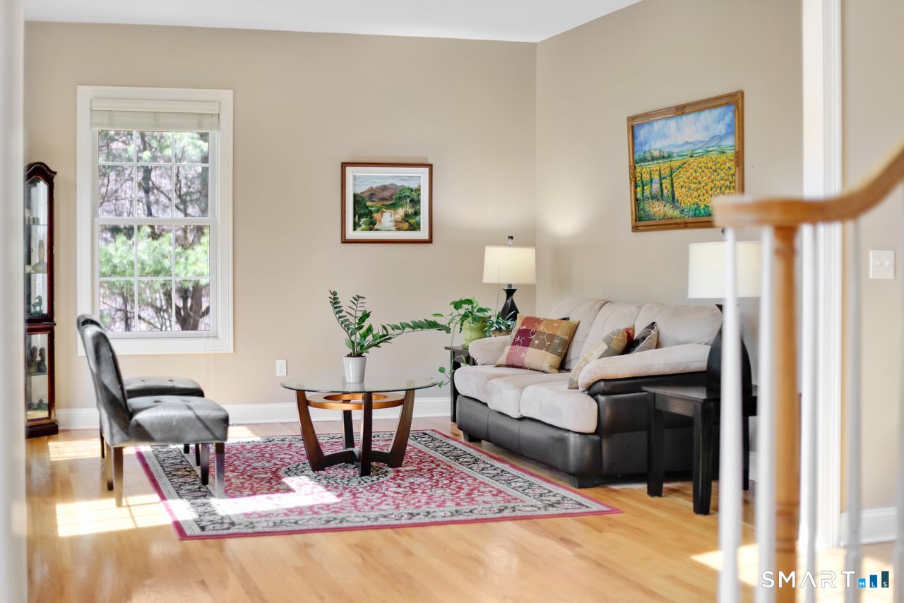 1 Bramble Trail Newtown, CT 06470 - Photo 4 of 31 a living room with furniture and a rug