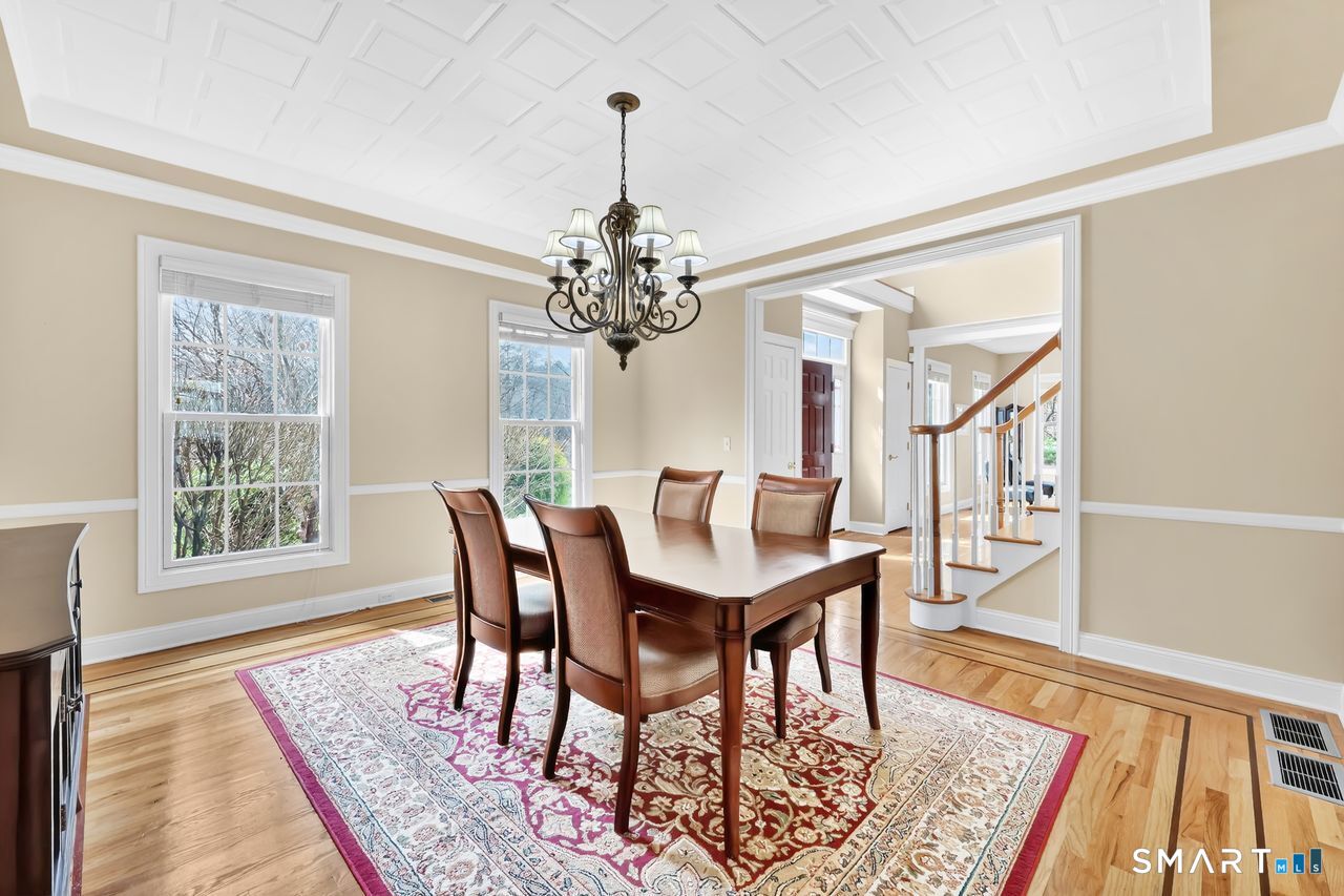 1 Bramble Trail Newtown, CT 06470 - Photo 6 of 31 a view of a dining room with furniture window and wooden floor