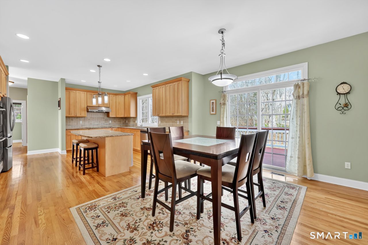 1 Bramble Trail Newtown, CT 06470 - Photo 8 of 31 a view of a dining room with furniture window and wooden floor
