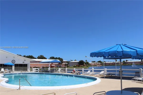 a view of a big building with swimming pool