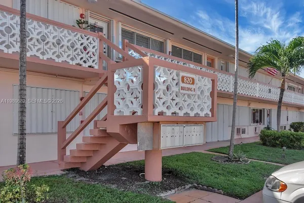 a view of a building with a yard