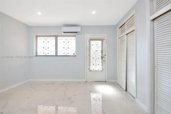 an empty room with windows