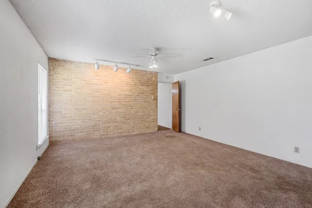 an empty room with a empty space and a window