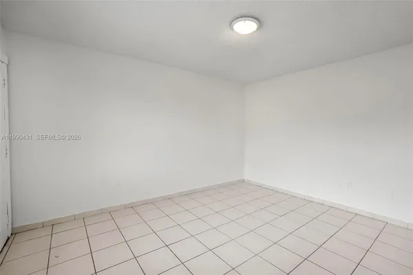 a view of a house with a garden and pathway