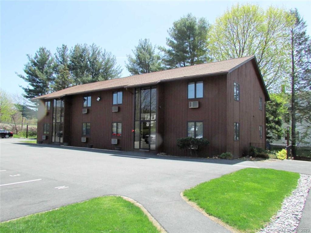 119 Kinney Street, Unit U1A Torrington, CT 06790 - Photo 1 of 1 a front view of a house with a garden