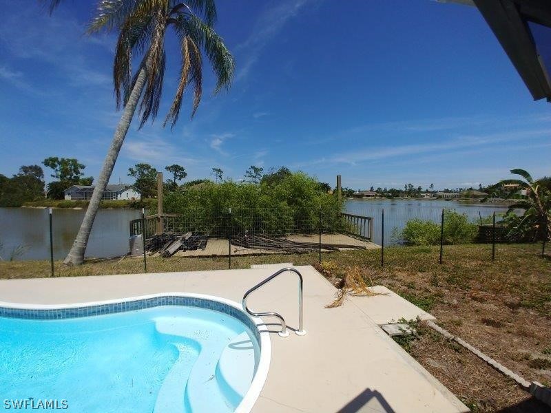 17245 Lee Road Fort Myers, FL 33967 - Photo 10 of 11 a view of a swimming pool with a yard