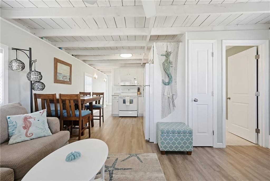271 Great Island Road, Unit G Narragansett, RI 02882 - Photo 7 of 25 a living room with furniture and a table