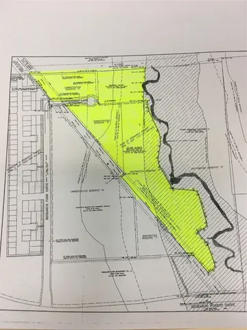 a view of a swimming pool with a yard