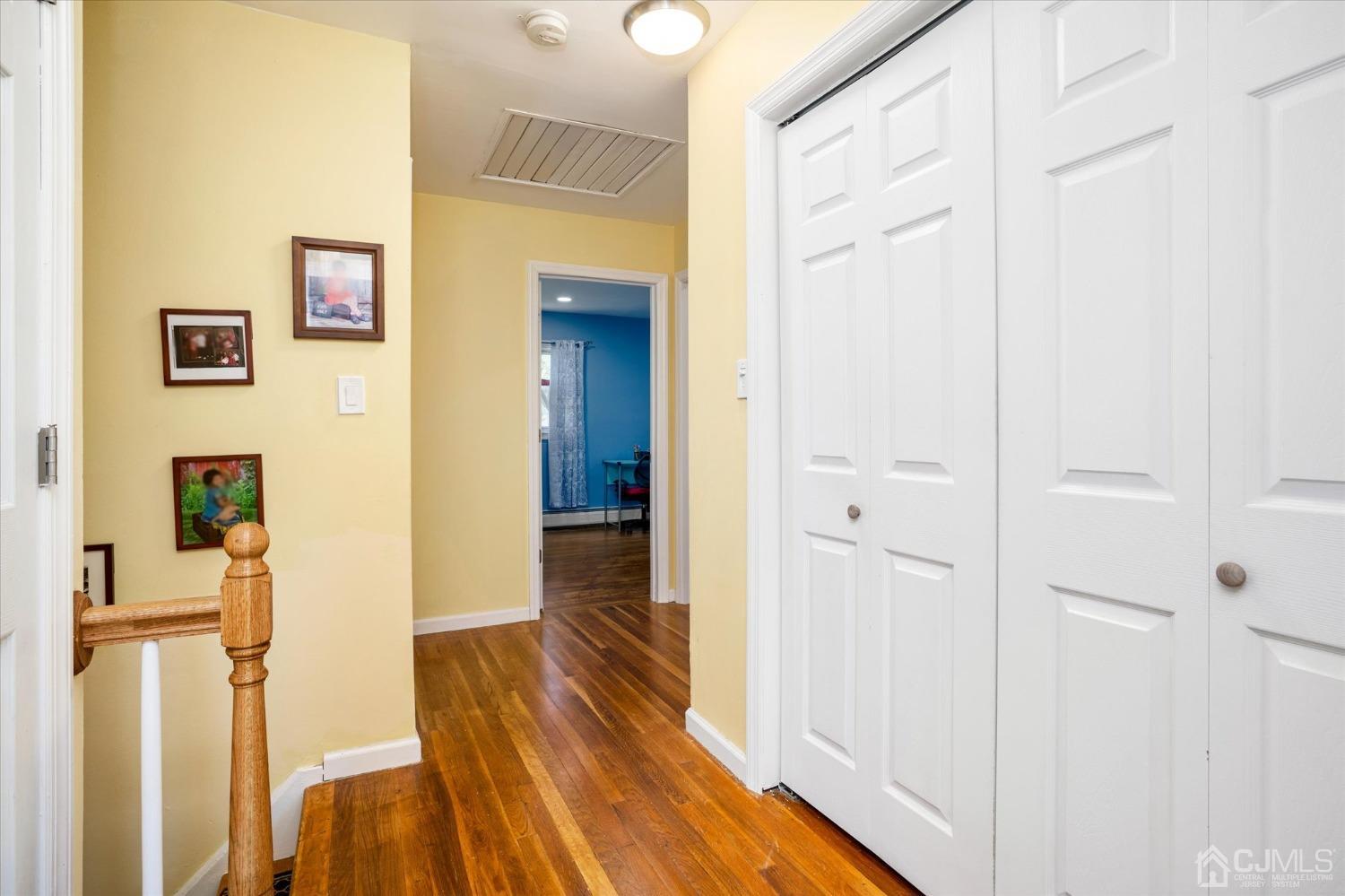 39 Lynnwood Road Edison, NJ 08820 - Photo 18 of 32 a view of a hallway with wooden floor and staircase