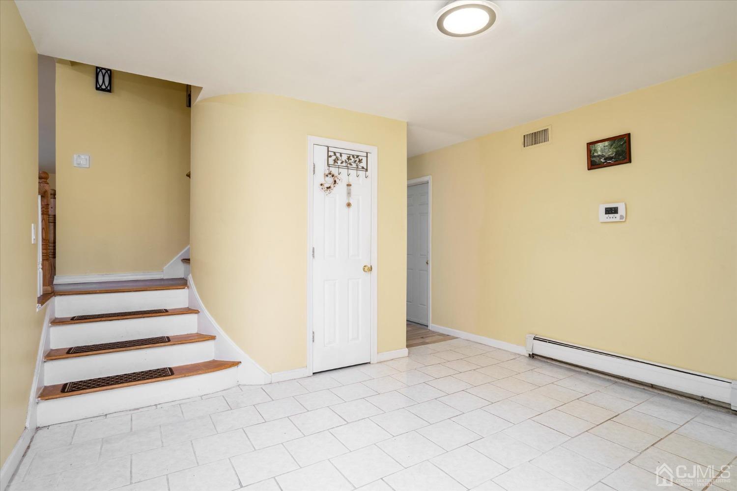 39 Lynnwood Road Edison, NJ 08820 - Photo 2 of 32 a view of a livingroom with wooden floor and white walls