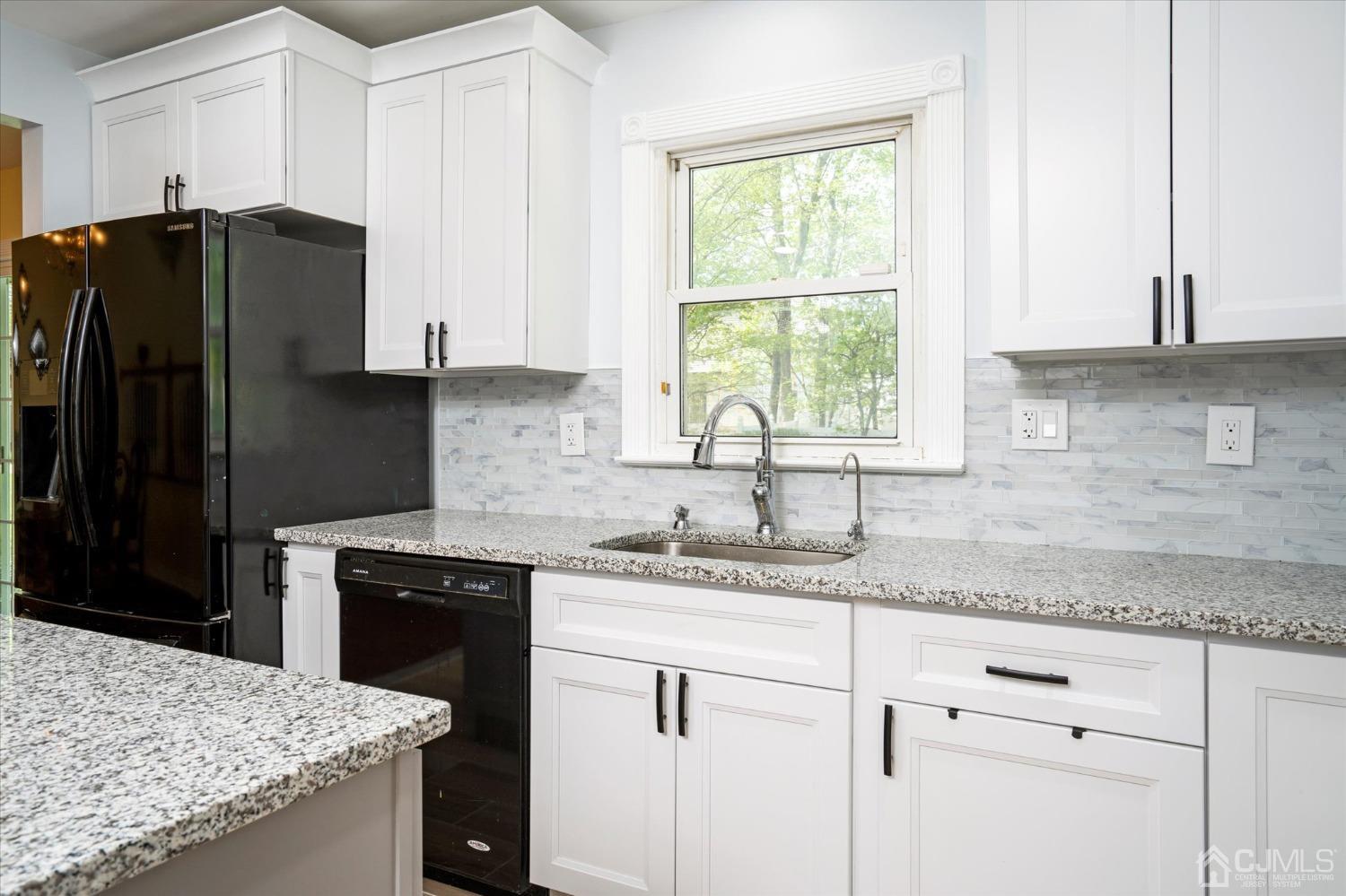 39 Lynnwood Road Edison, NJ 08820 - Photo 7 of 32 a kitchen with granite countertop a sink stove and refrigerator