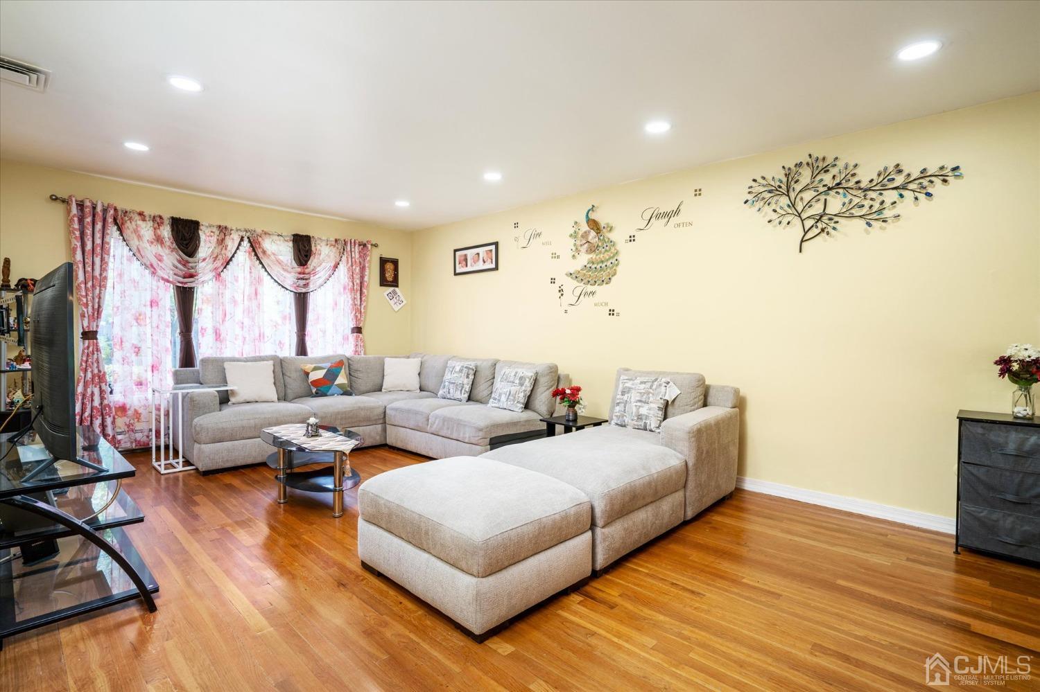 39 Lynnwood Road Edison, NJ 08820 - Photo 10 of 32 a living room with furniture and a flat screen tv