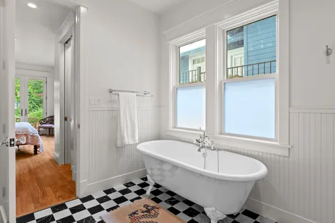 a bedroom with a bed and a view of bedroom