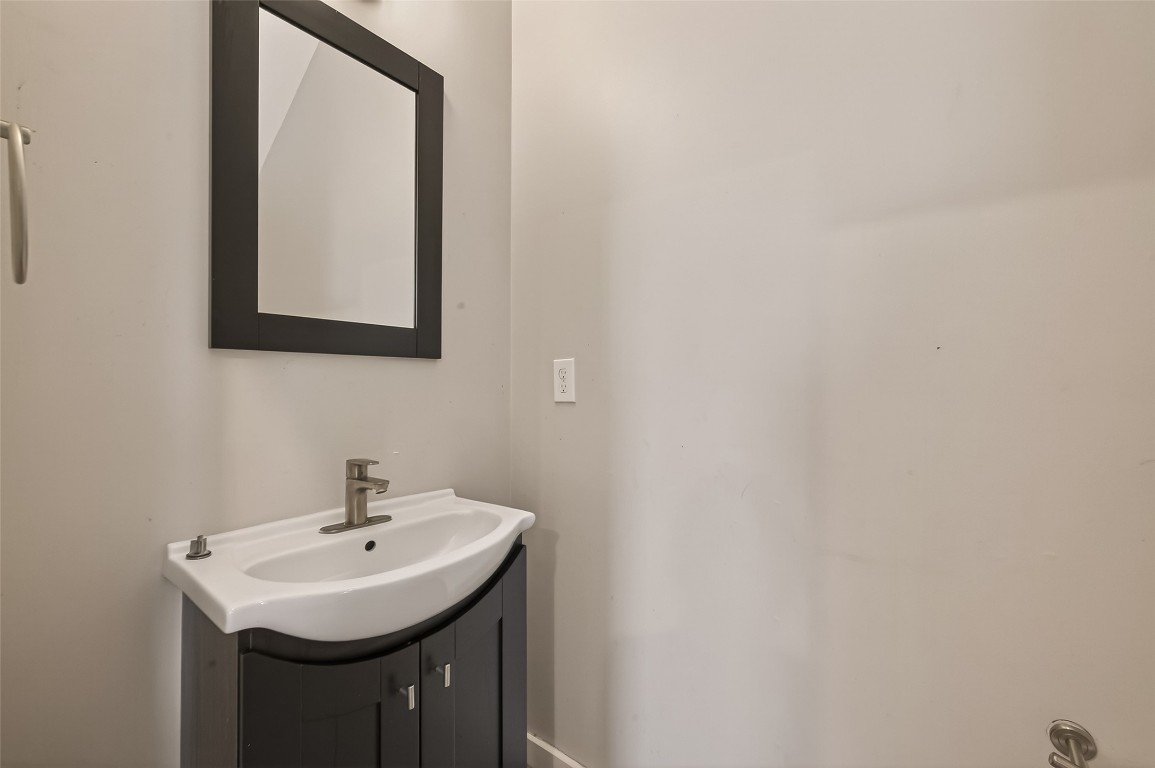 1819 South Street Houston, TX 77009 - Photo 14 of 27 a bathroom with a sink and a mirror