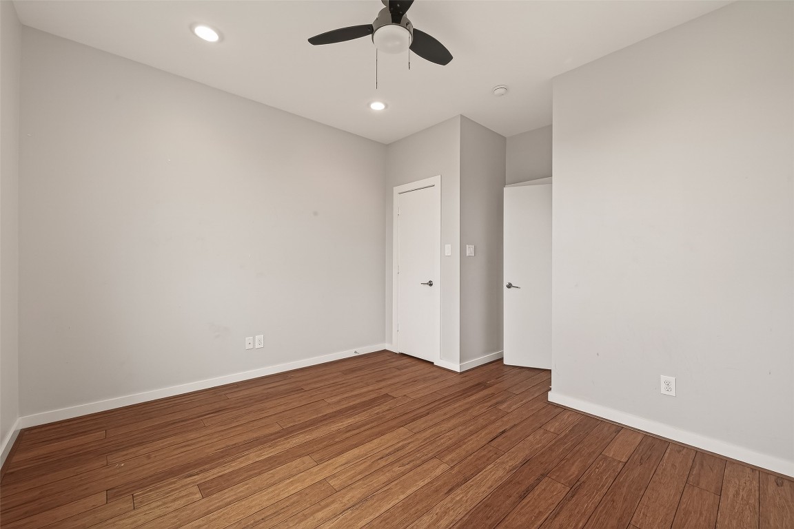 1819 South Street Houston, TX 77009 - Photo 21 of 27 an empty room with wooden floor ceiling fan and window