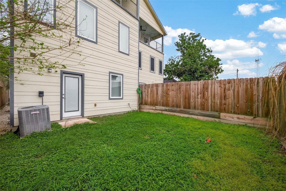 1819 South Street Houston, TX 77009 - Photo 25 of 27 a view of a backyard with potted plants and wooden fence