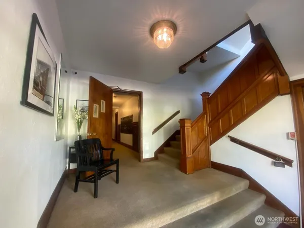 a view of a hallway with windows