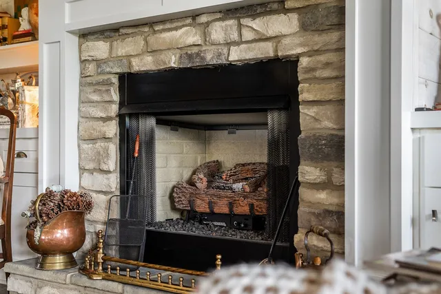 a bedroom with a bed couch and window