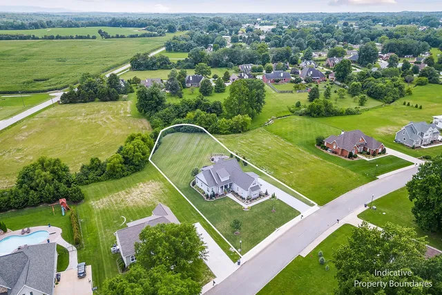 an aerial view of a golf course with a garden