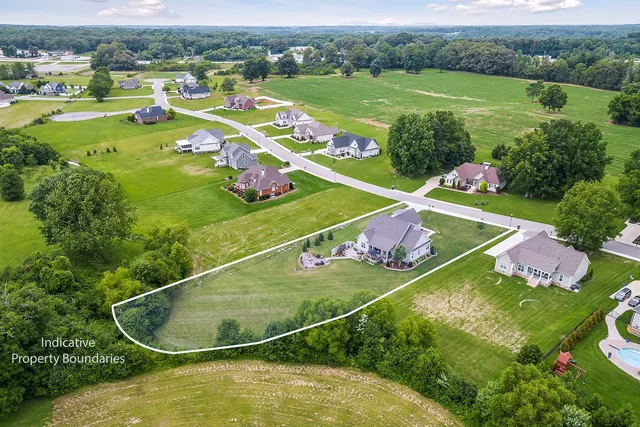 an aerial view of a pool yard and outdoor seating