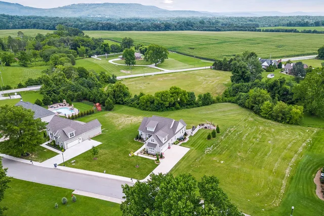 an aerial view of a golf course with a garden