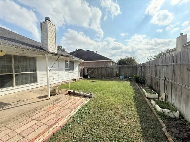 a house view with a garden space