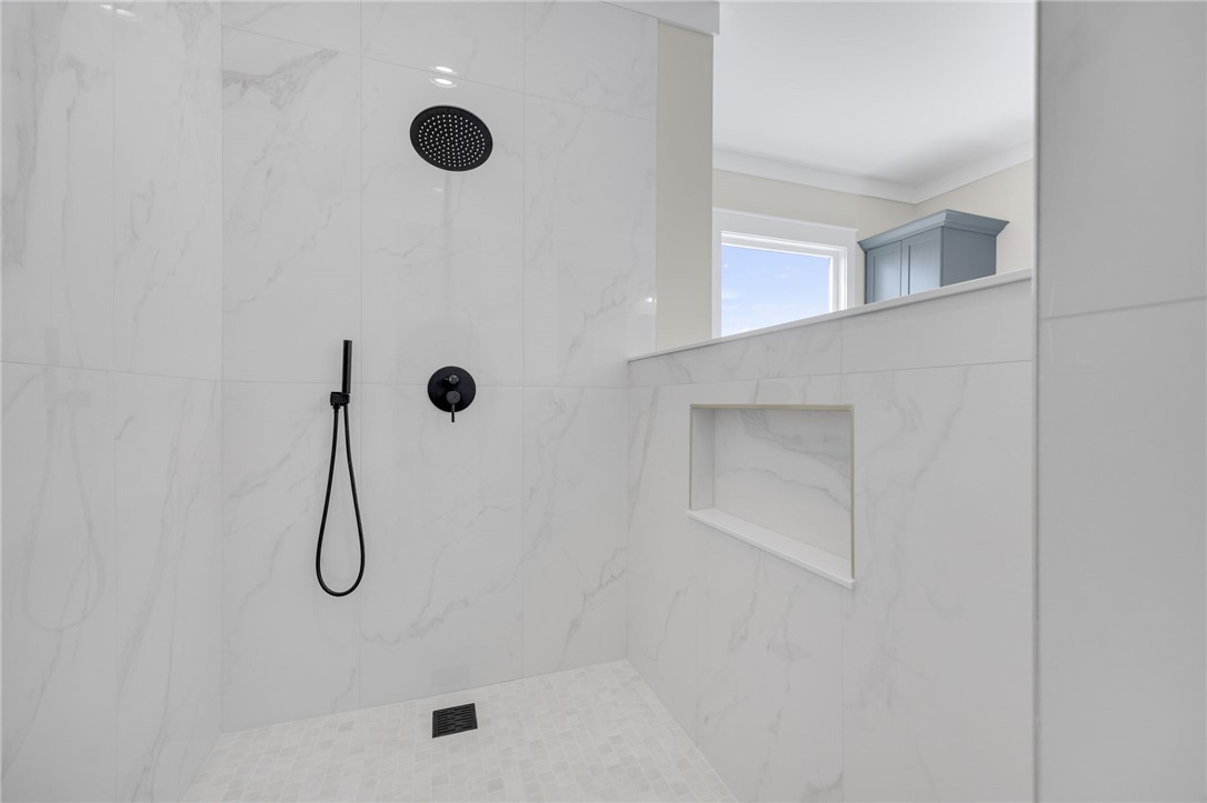 384 Jim Smith Road Pendleton, SC 29670 - Photo 19 of 48 Floor-to-ceiling marble-patterned tile enhances this modern walk-in shower with matte black fixtures.