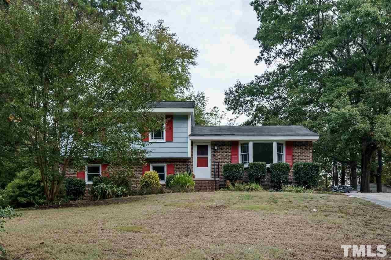 3213 Broyhill Circle Raleigh, NC 27604 - Photo 1 of 15 a front view of a house with a yard and potted plants