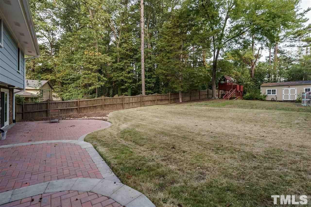 3213 Broyhill Circle Raleigh, NC 27604 - Photo 14 of 15 a backyard of a house with lots of green space