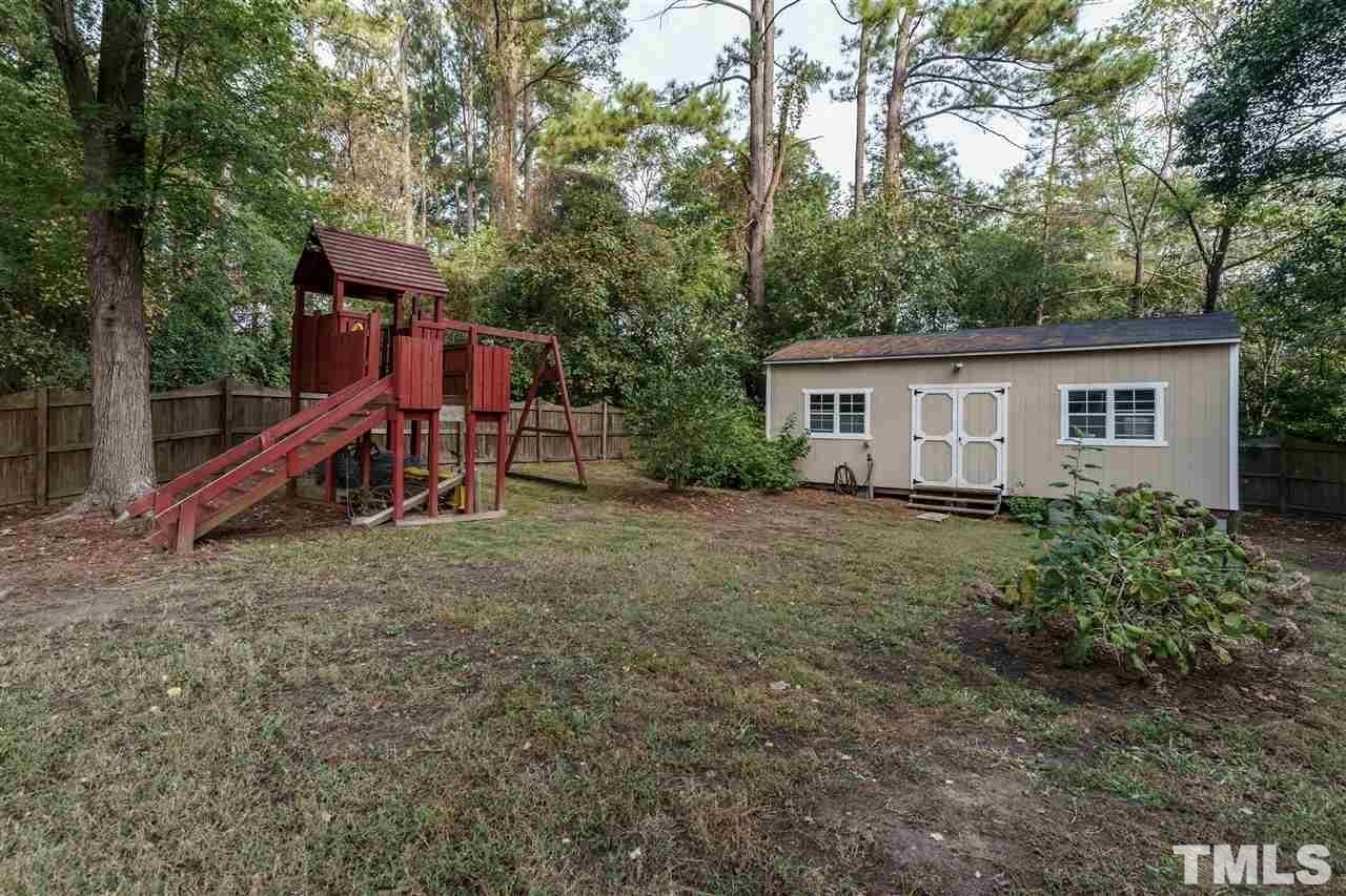 3213 Broyhill Circle Raleigh, NC 27604 - Photo 15 of 15 a view of a house with a yard and a slide