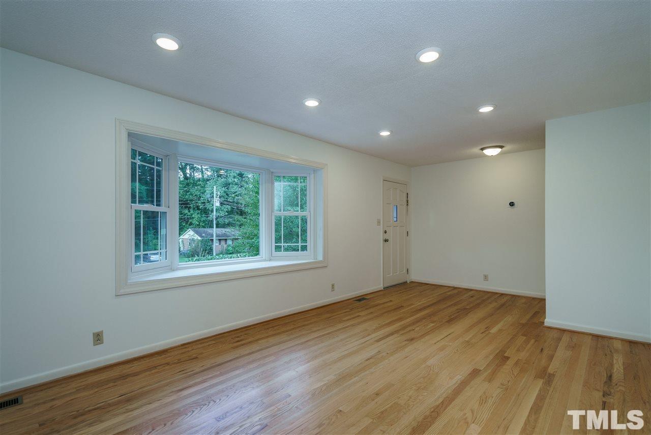 3213 Broyhill Circle Raleigh, NC 27604 - Photo 3 of 15 a view of empty room with wooden floor and fan