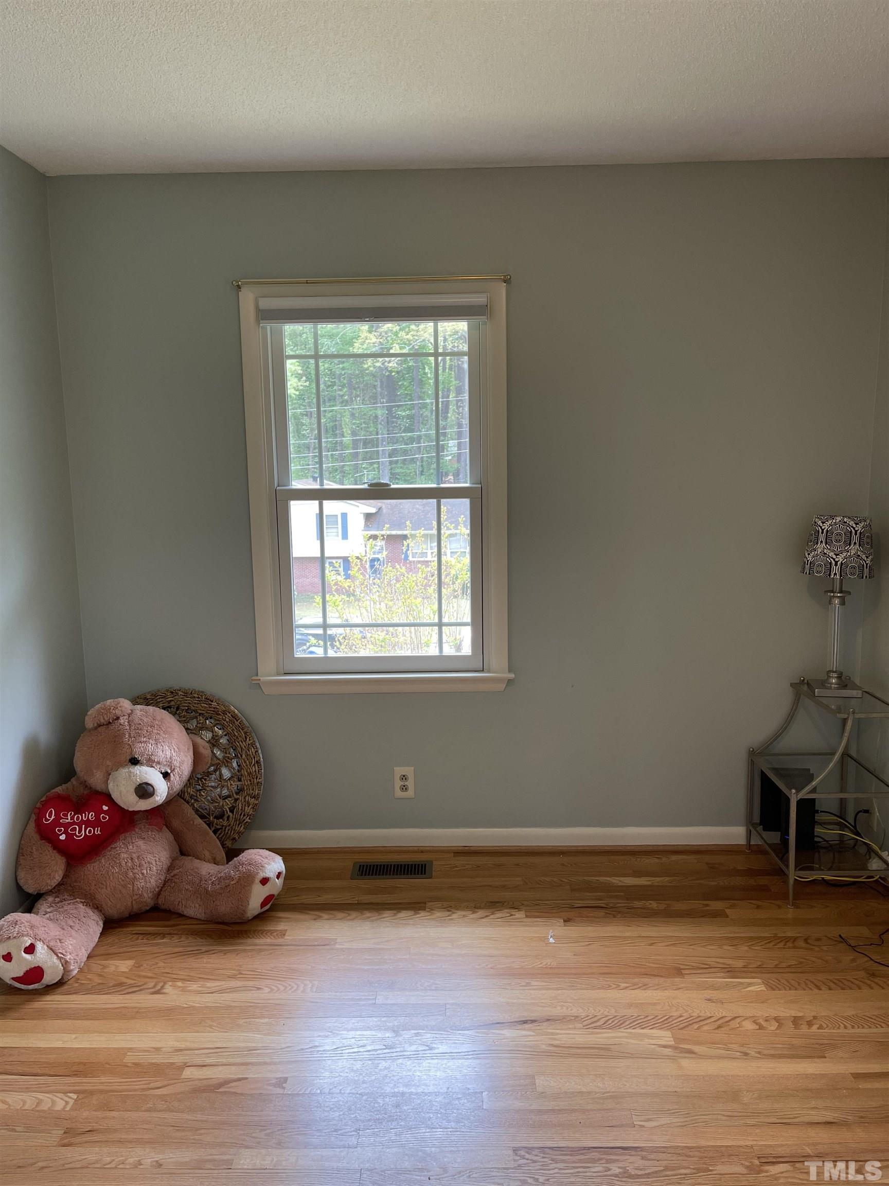 3213 Broyhill Circle Raleigh, NC 27604 - Photo 8 of 15 a view of a room with wooden floor and a window