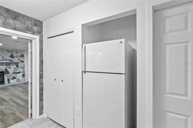 a white refrigerator freezer sitting in a kitchen
