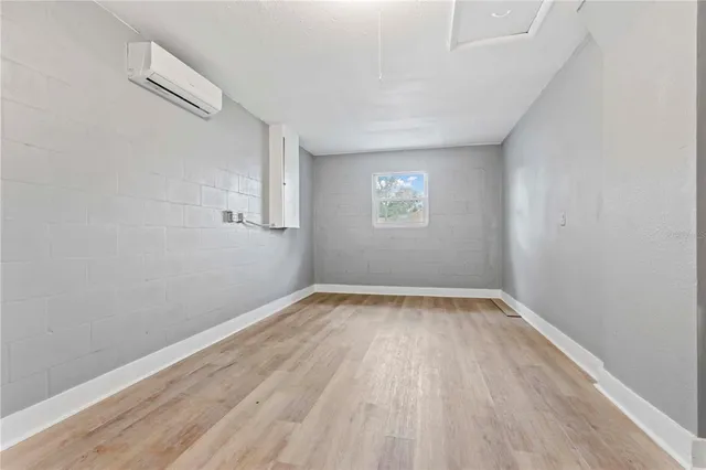 a bathroom with a toilet sink vanity and mirror