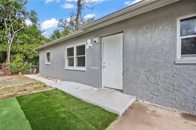 a house view with a backyard space