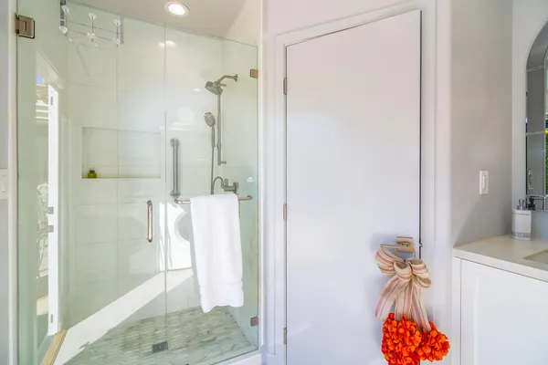 a bathroom with a shower and a sink
