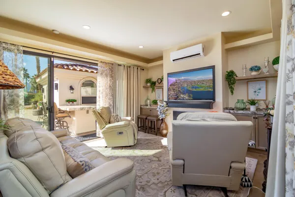 a living room with furniture and a large window