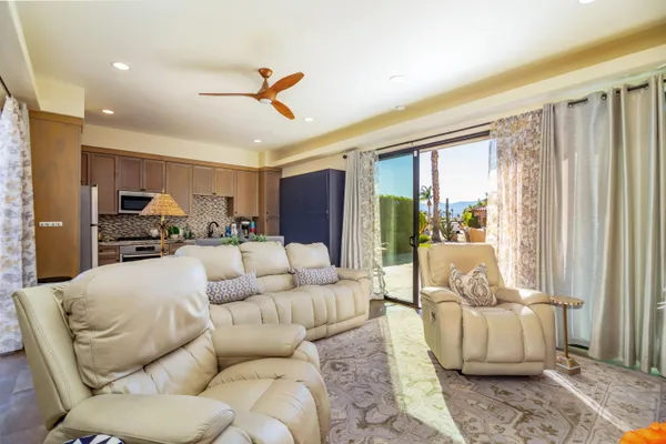 a living room with furniture and a large window