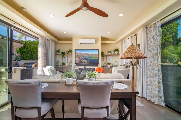 a view of a dining room with furniture window and outside view