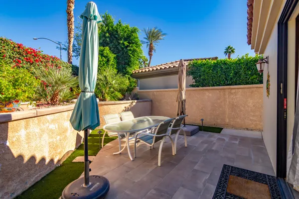 an outdoor view of garden with patio