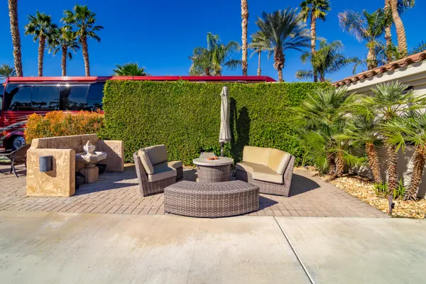 a outdoor living space with furniture and a potted plant