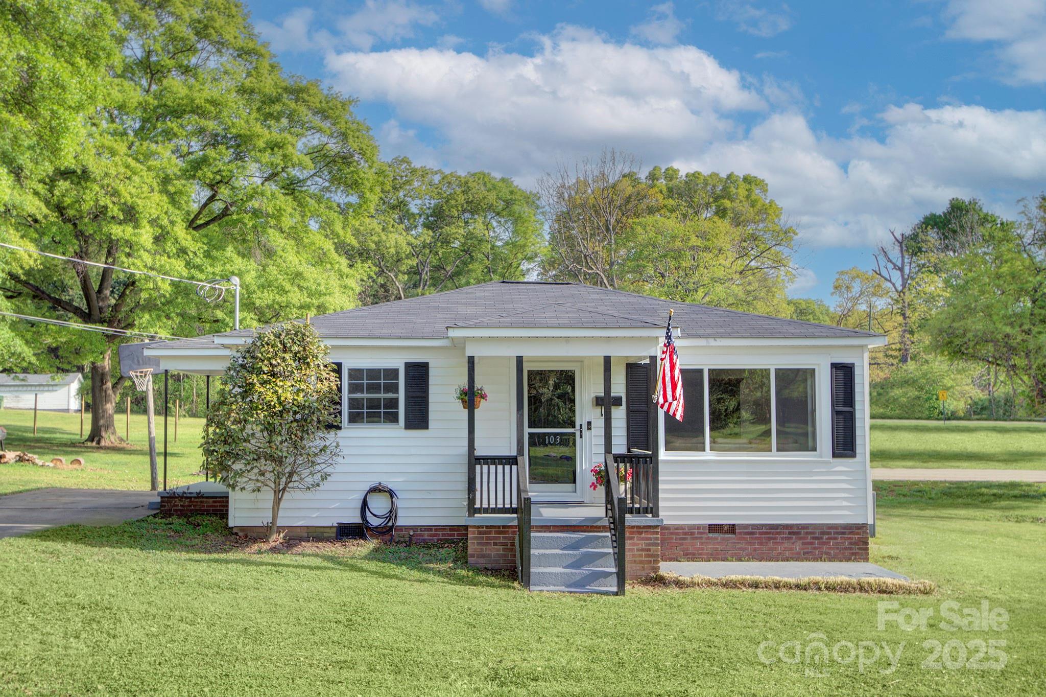 103 Moore Avenue Mount Holly, NC 28120 - Photo 1 of 21 a view of a house with a yard