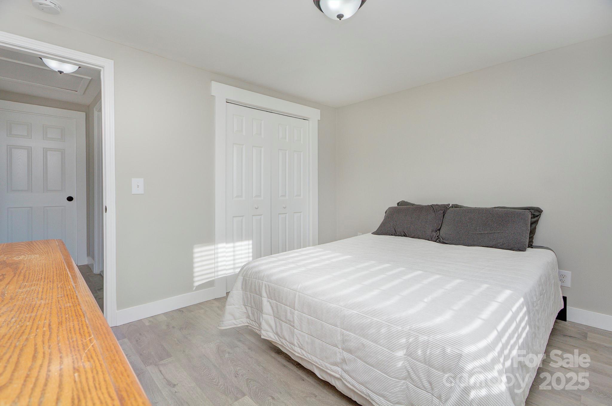103 Moore Avenue Mount Holly, NC 28120 - Photo 12 of 21 a large white bed in a white room